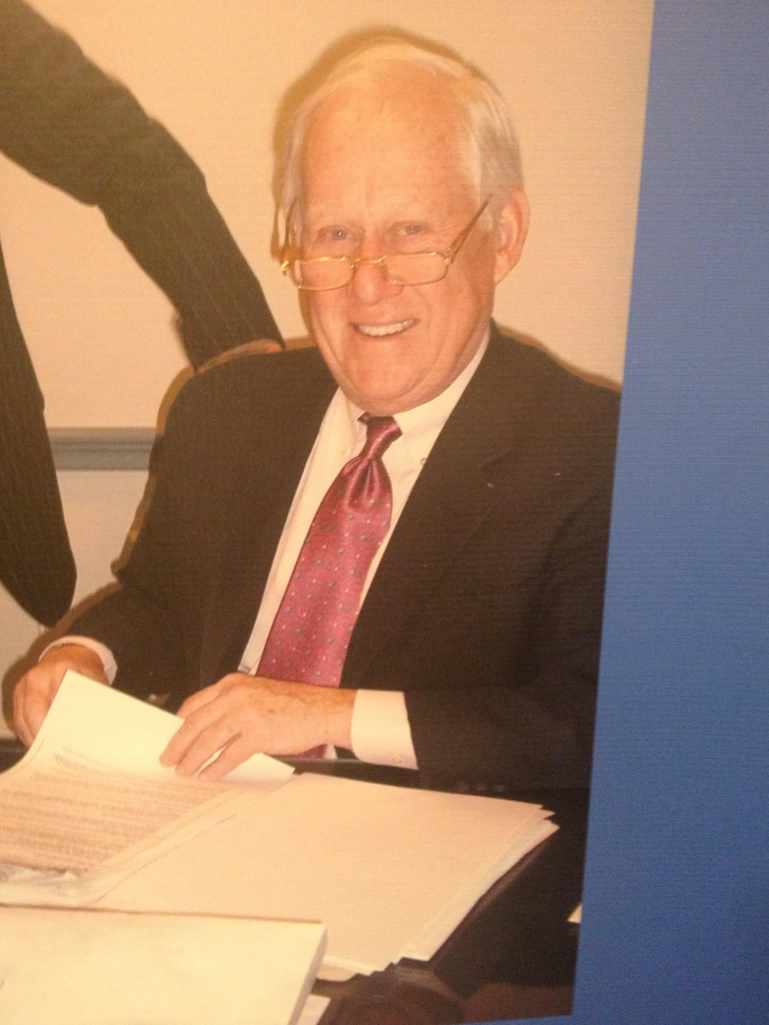 Dave signing documents at the office. (Photo: Supplied)